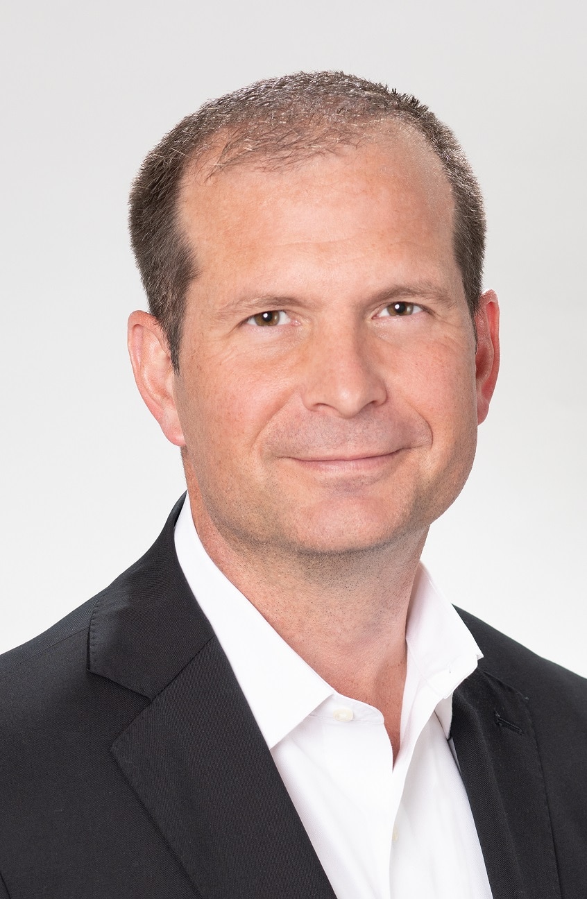 A professional headshot of Dennis Beeson