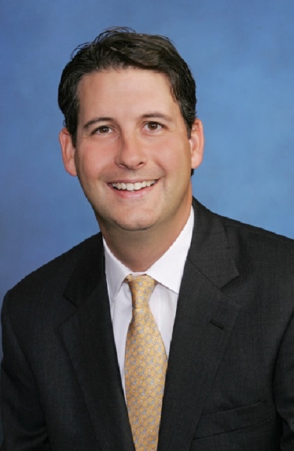 A professional headshot of Jeff Daly