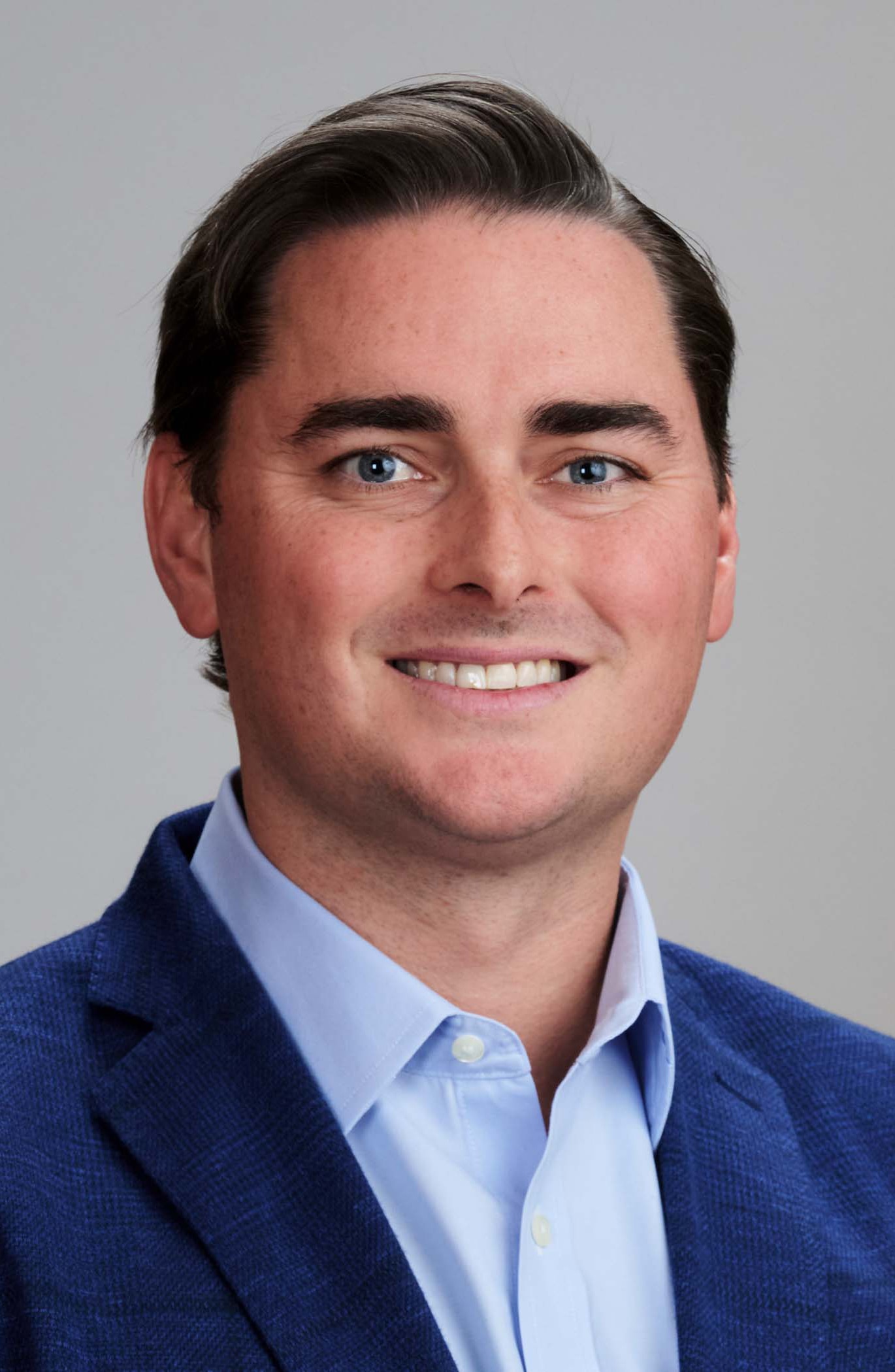 A professional headshot of Matt Doherty