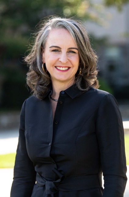 A professional headshot of Carra Cote-Ackah