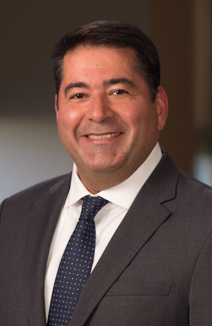 A professional headshot of Farshid Asl