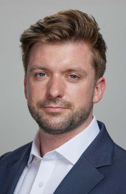 A professional headshot of Ed Rose